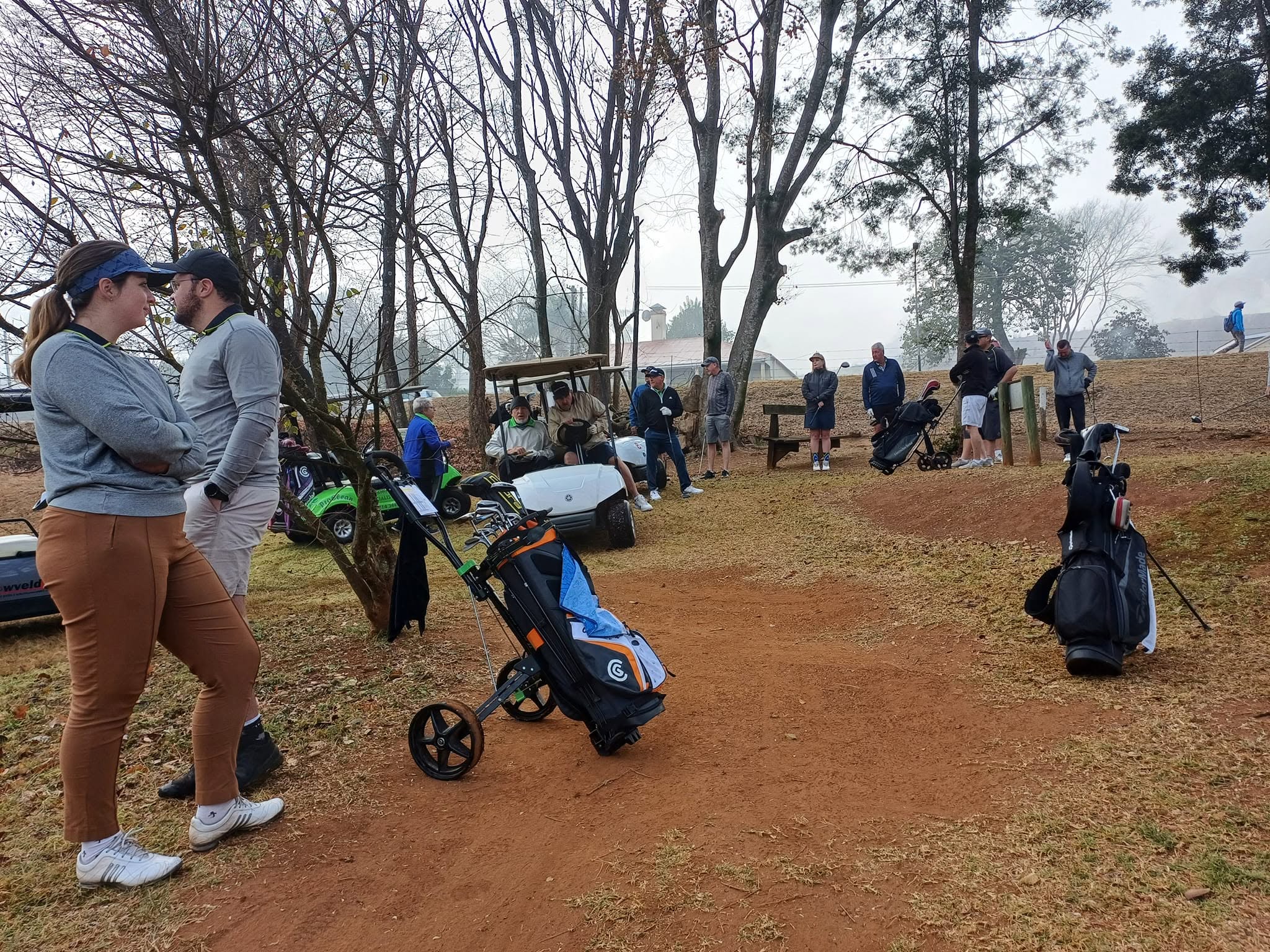 Golfers getting ready for a round on a cool morning